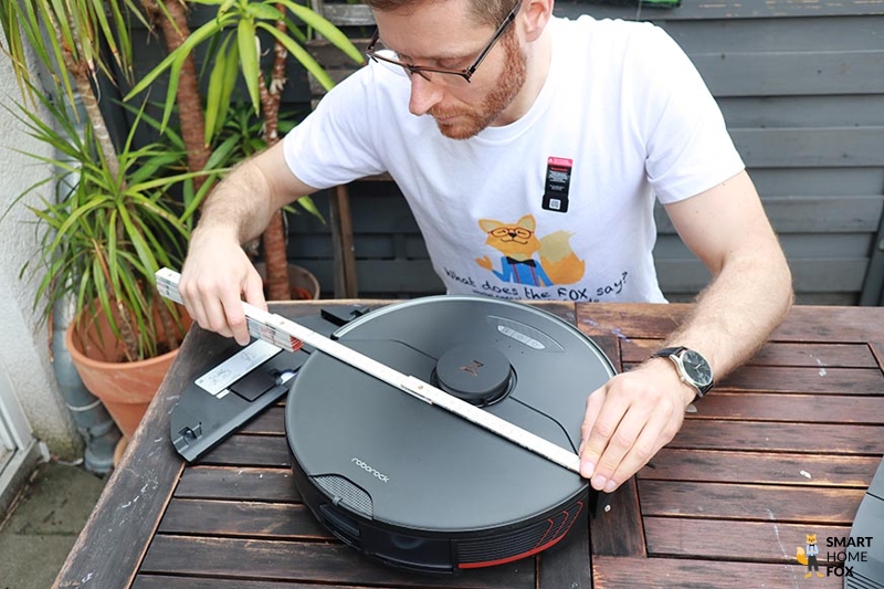The Roborock S7 MaxV is measured with a ruler.